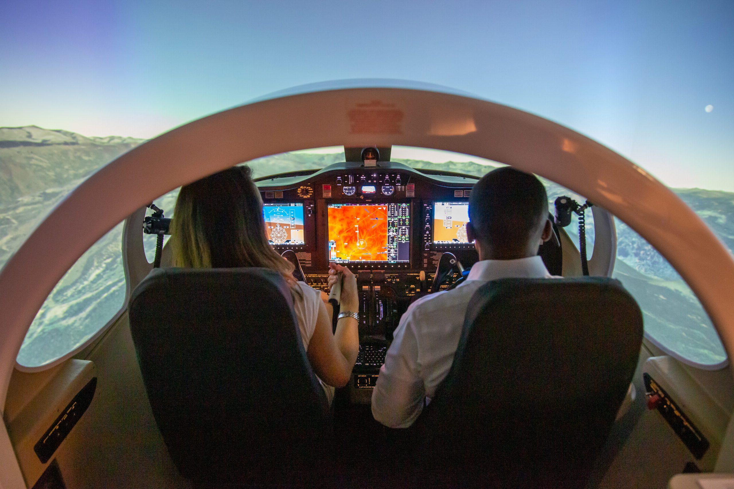 General McDew and Dr. Davidson visits Aerospace and Engineering Science Building. President Janine Davidson and General Darren McDew experience the flight simulator in the 7th Street Classroom building on Thursday, Oct. 27, 2022. President Janine Davidson, Ph.D., and General Darren McDew fly the simulator in the 7th Street Classroom.